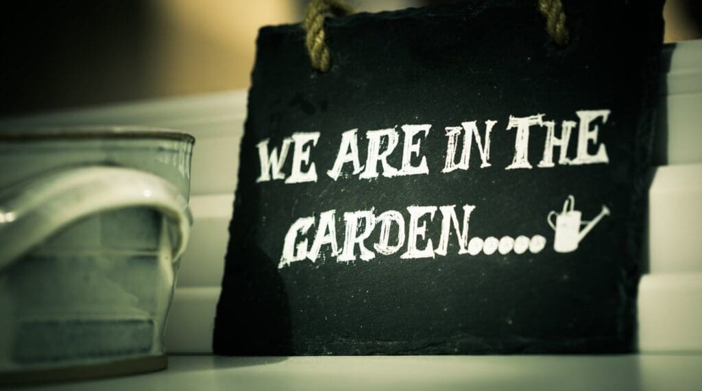 Sign saying "we are in the garden" - how to create an eco-friendly garden