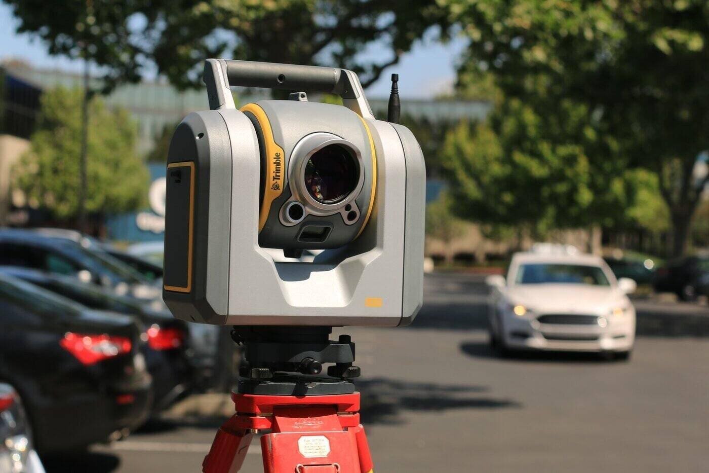 4 Things You Need To Know About Surveying And How It Works 2 Theodolite in parking lot - 4 things to know about surveying and how it works