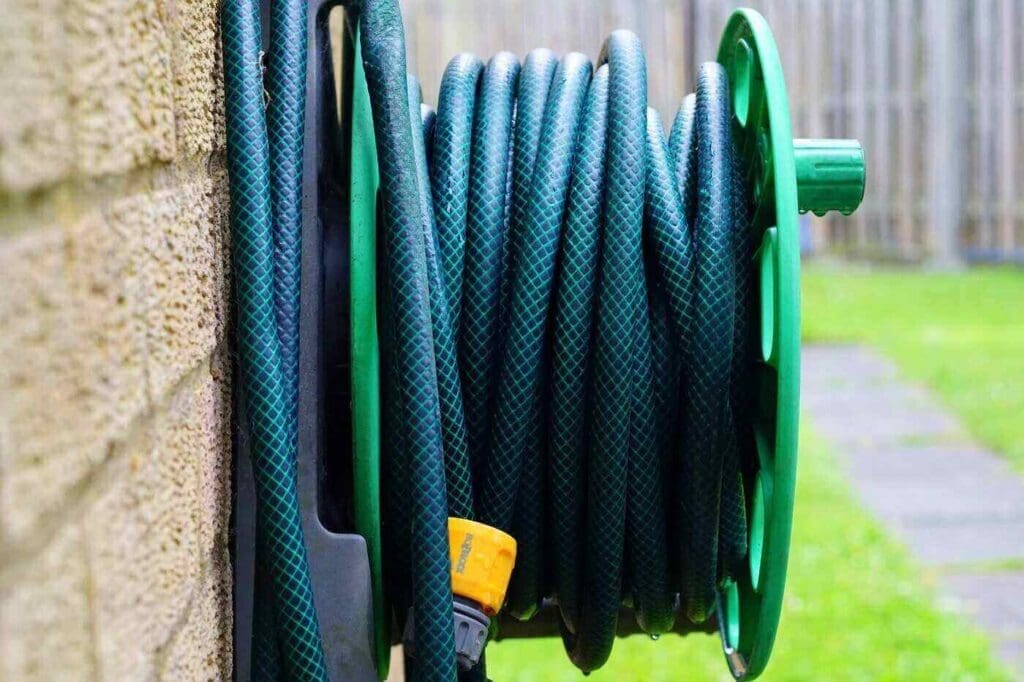 Garden hose on hose rack - how to efficiently heat water outdoors
