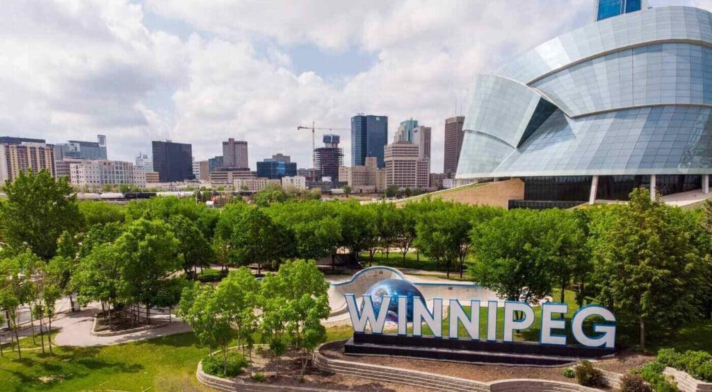 Forks area of winnipeg with winnipeg sign - geothermal energy comes to downtown winnipeg