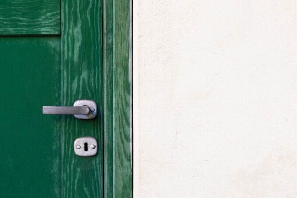 How To Properly Air Seal Your Home 4 Close up of green door and handle - how to properly air seal your home