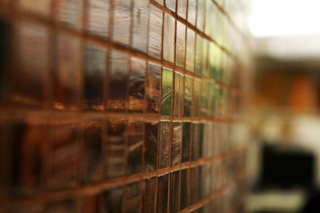 Close up of tile wall - how to regrout tile without removing old grout