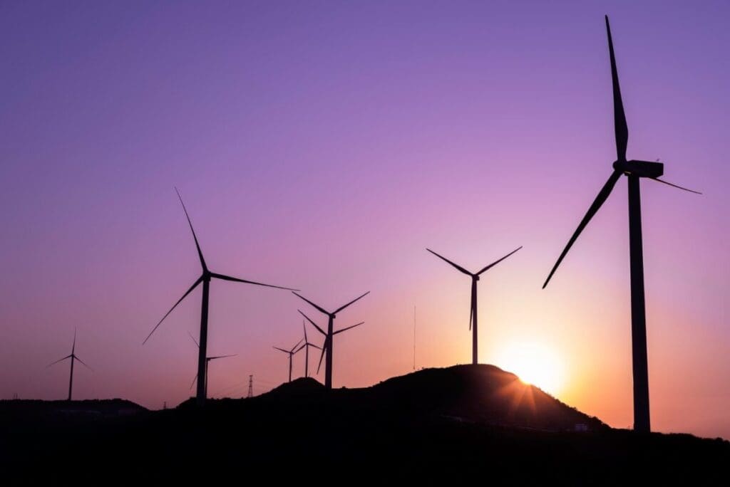 Wind turbines against purple sky - wind energy projects newfoundland labrador
