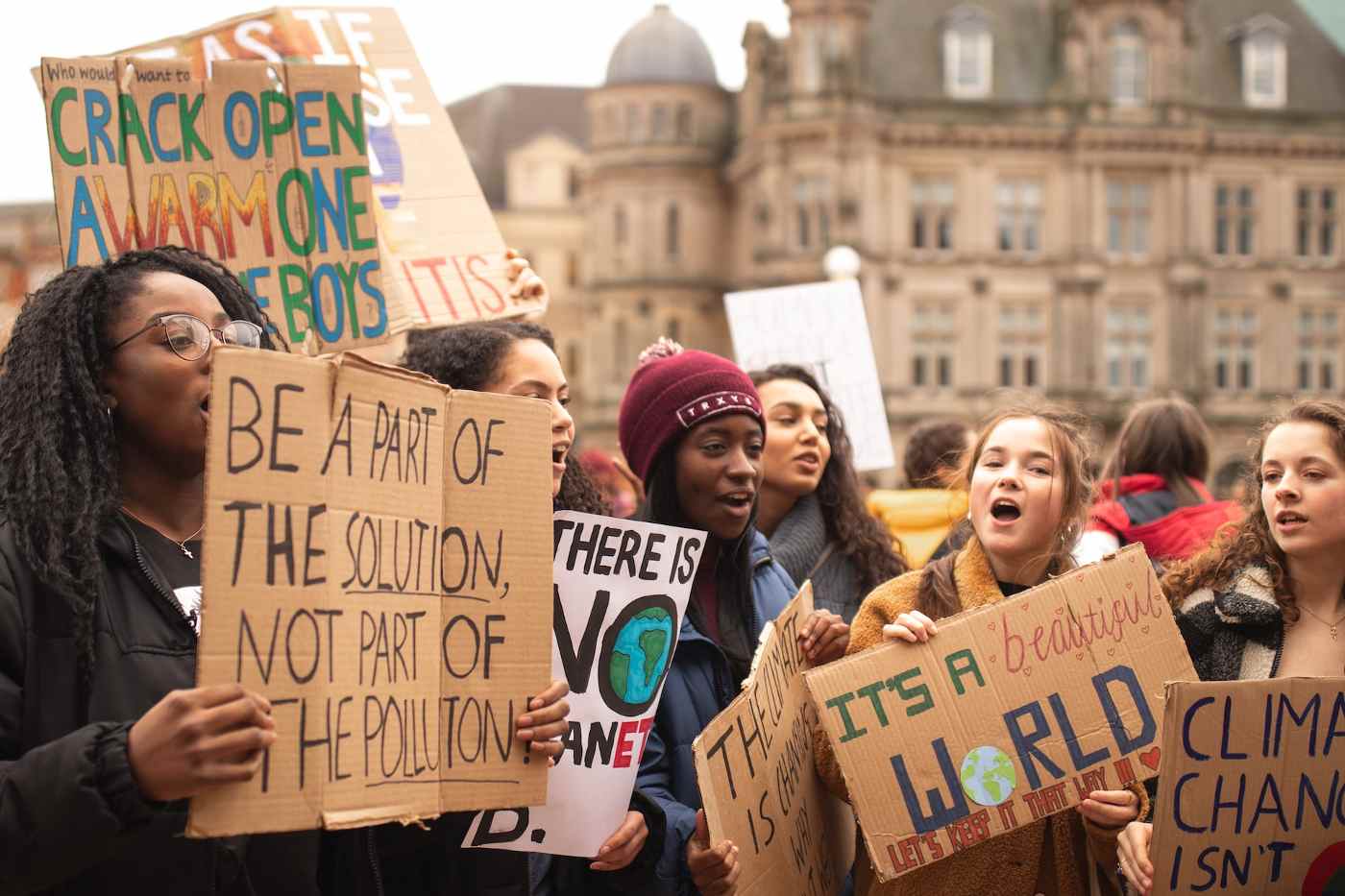 Girls protesting climate change - how green buildings will help ontario deal with climate change