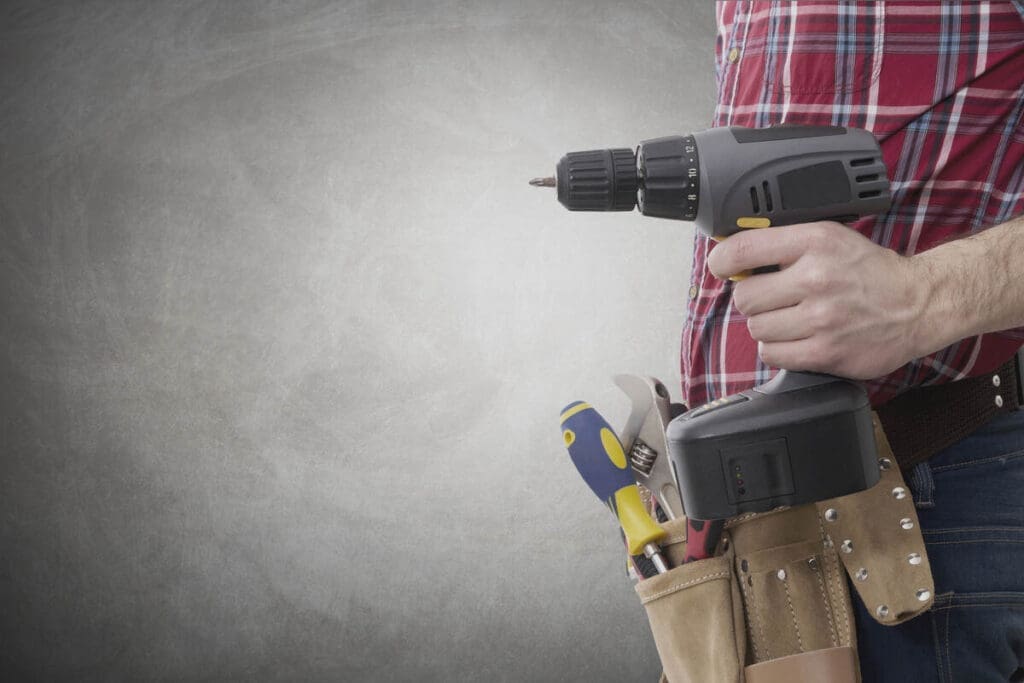 Construction worker with screwdriver