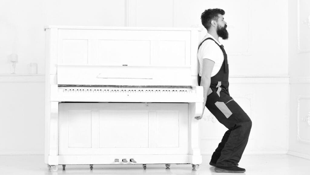 Mover moving a piano