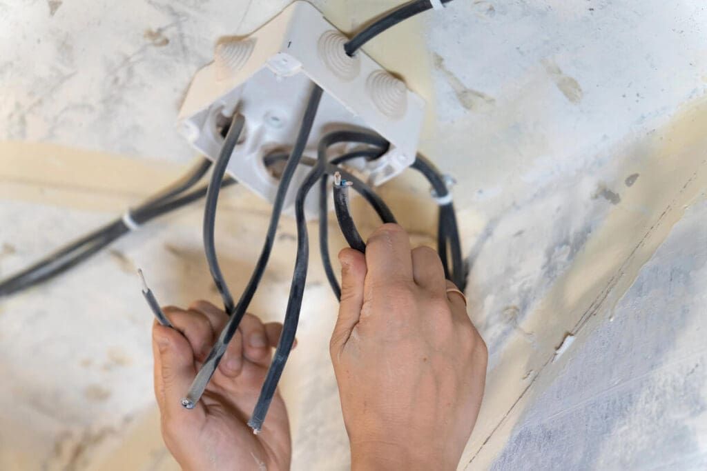 Electrician installing wiring