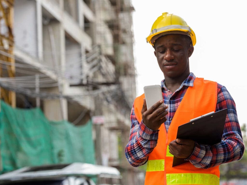 How Mobile Technology Is Transforming Inspections On Construction Sites 4 Building inspector using mobile phone