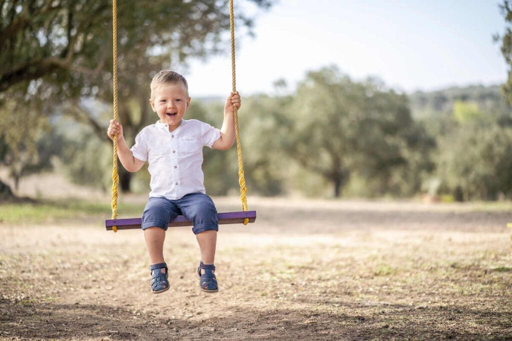 How To Choose A Sustainable Kids Swing Set 7 Child on swing