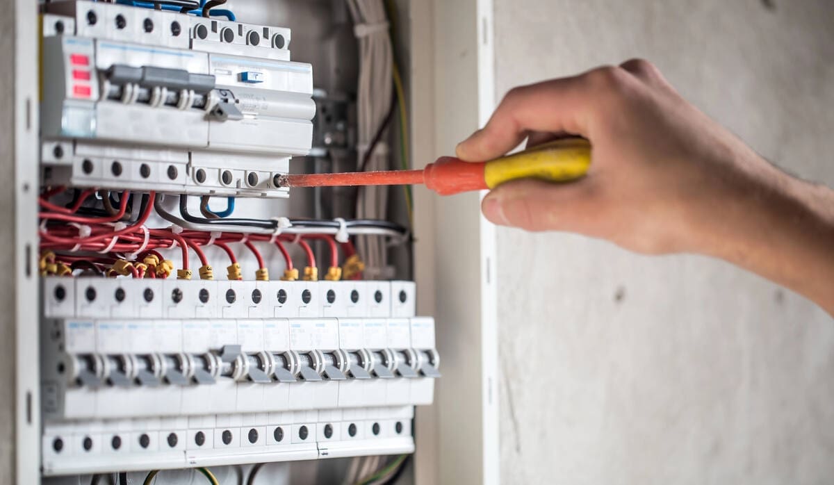 Electrician wiring electrical panel