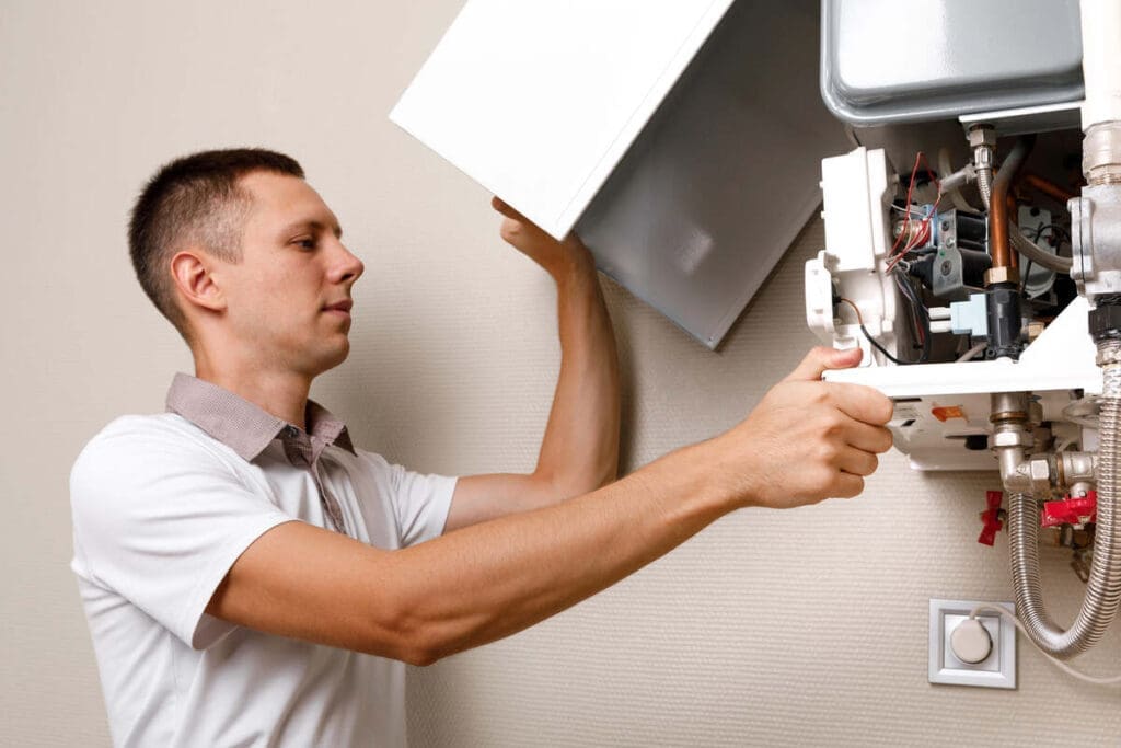 Average Furnace Cleaning Cost In Canada 6 Repairman fixing hvac