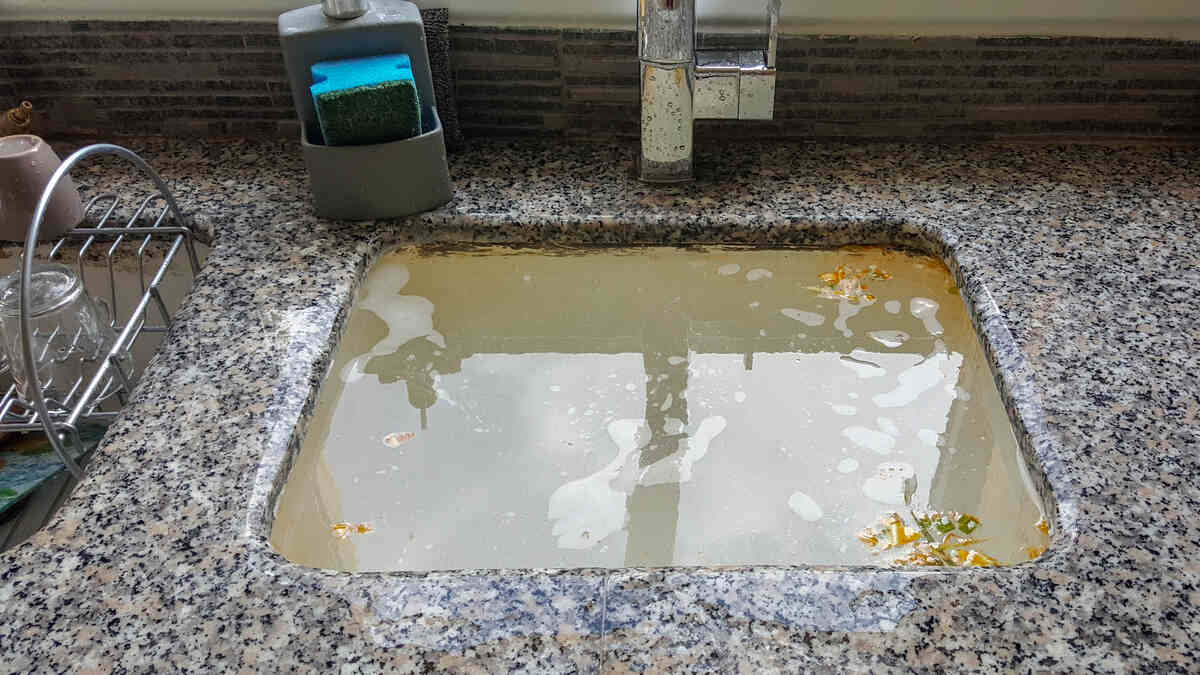 Kitchen sink drain clogged - water filled to top