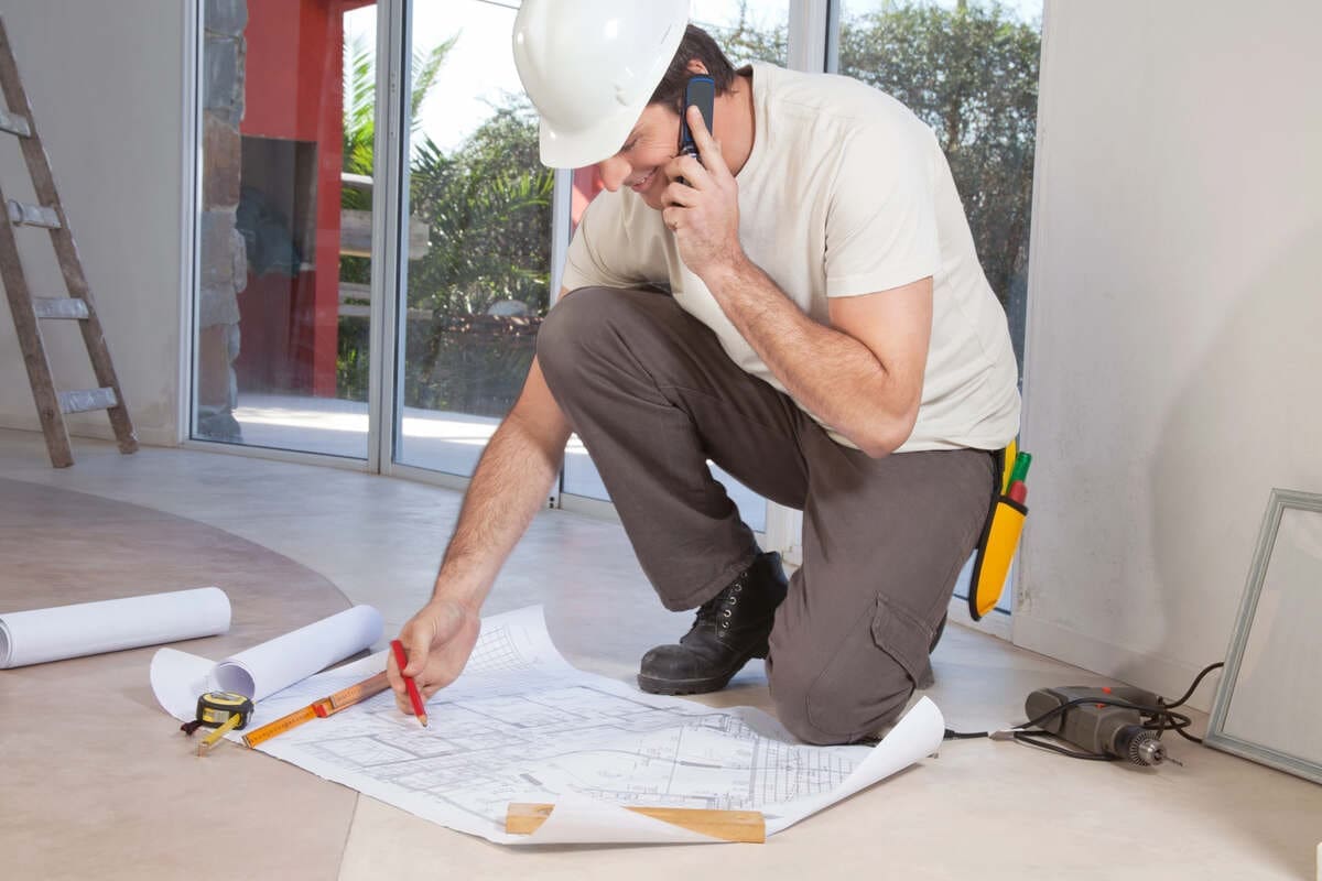Contractor talking on phone during home renovation