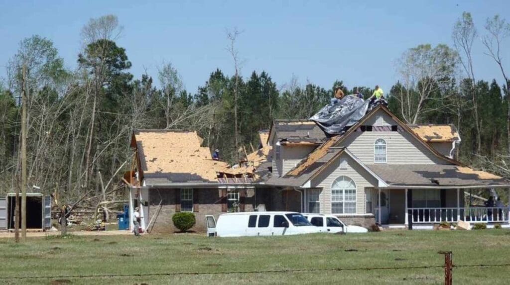Here'S Why Garage Doors Get Blown Open (And What To Do About It) 3 Garage with wind damage done