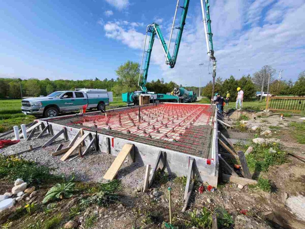Is A Slab On Grade A Better Option When It Comes To Mitigating Flood Risk? 6 Pouring concrete for foundation-house