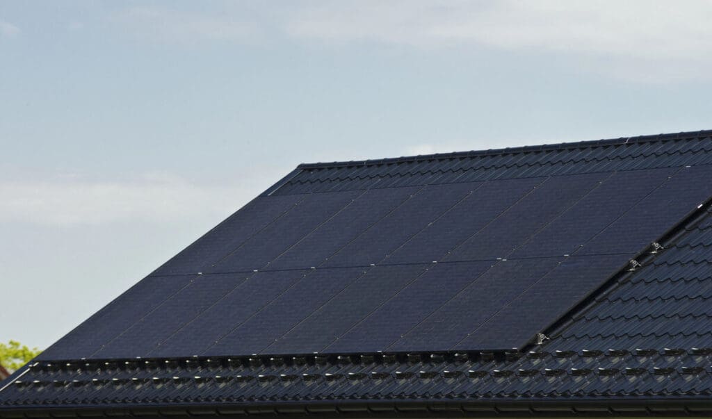 Roof-mounted solar panels on house