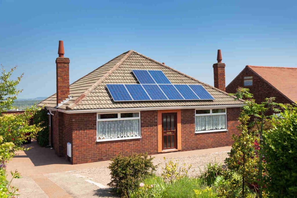 Small house with solar panels on roof
