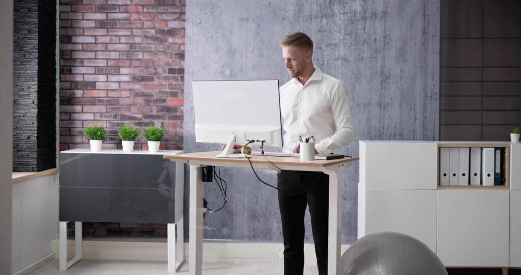 Working at a standing desk in office