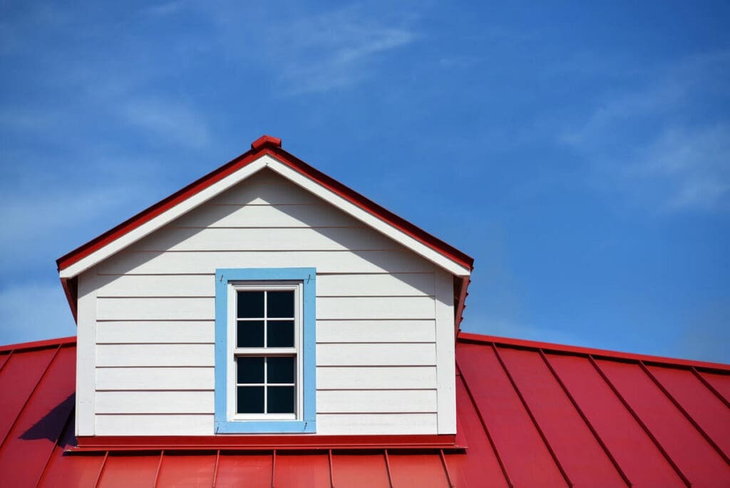 House with red metal roofing