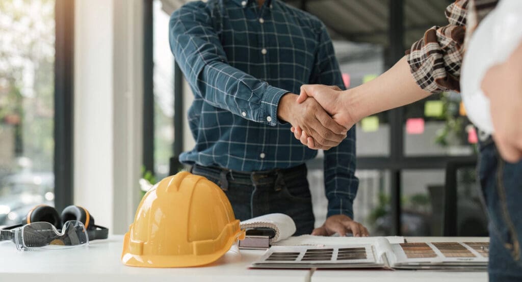 Contactor and homeowner shaking hands