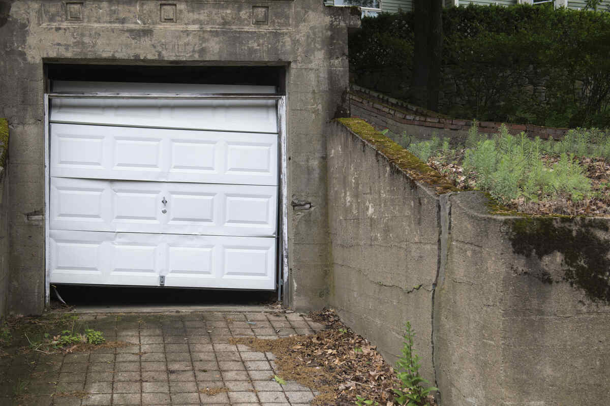 Broken garage door side gap