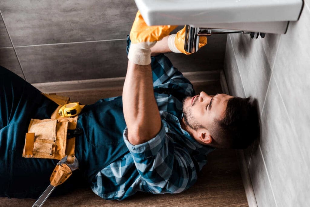 Plumber fixing repair