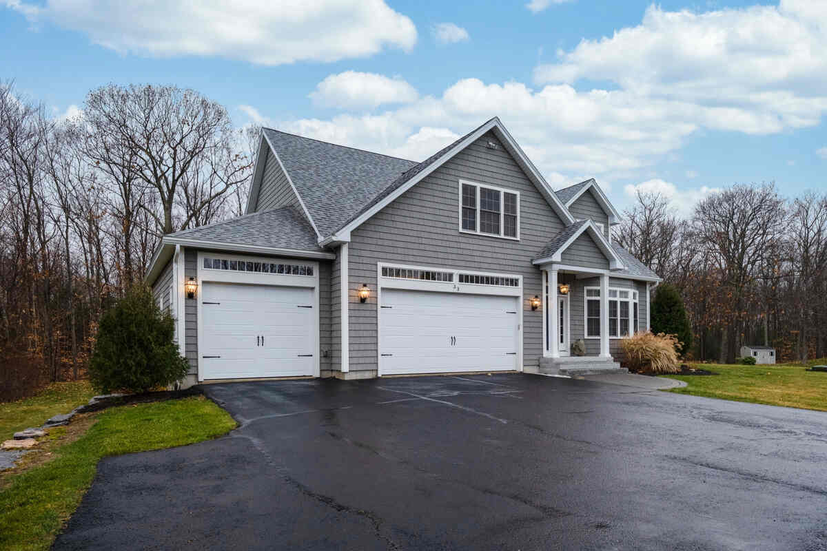 Sealcoating Secrets: Extend the Life of Your Asphalt 1 sealcoating an asphalt driveway