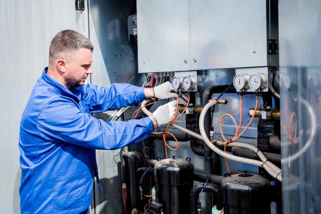 hvac tech repairing equipment