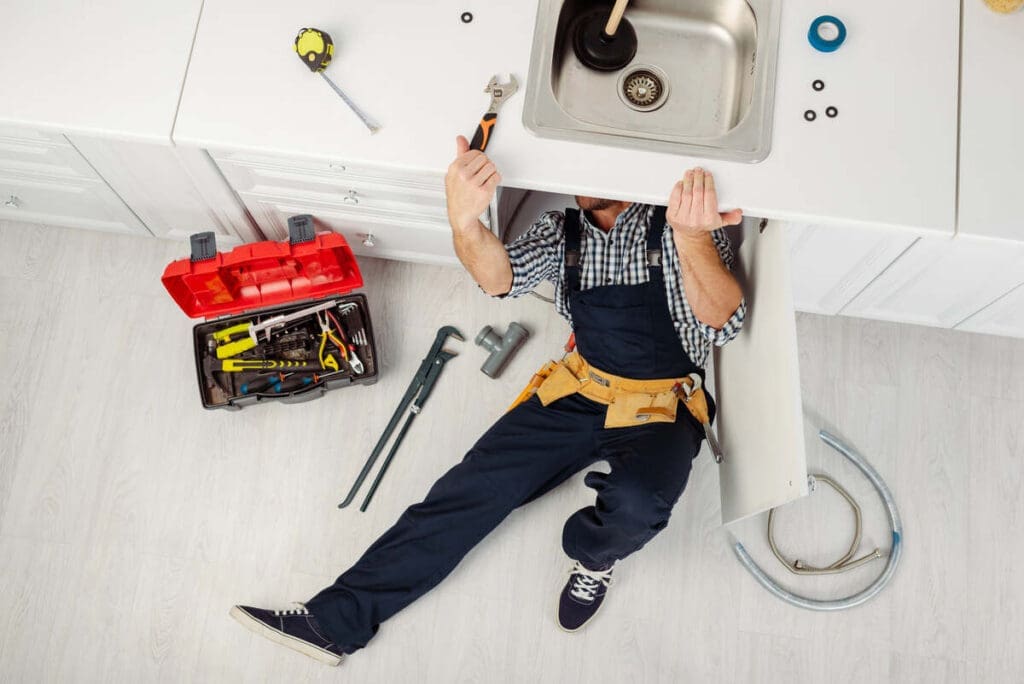 plumber inspecting sink